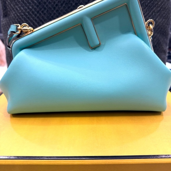 Fendi Handbags - Fendi Turquoise Clutch with Gold Accents